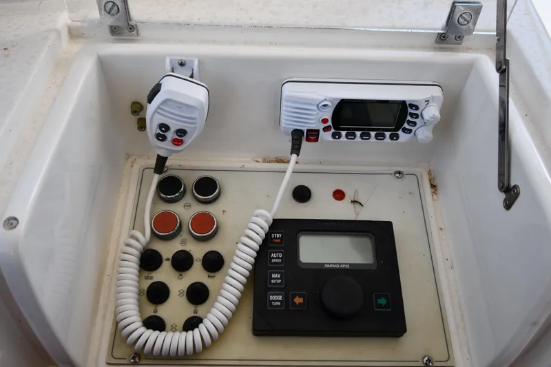 Slide: The Image of Control panel of a 2001 Ferretti Yachts 72, featuring communication and navigation equipment. - 35