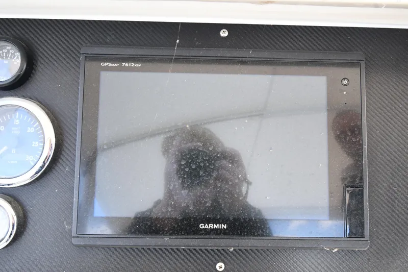 Slide: The Image of Garmin GPS display on 2001 Ferretti Yachts 72 dashboard with gauges. - 36