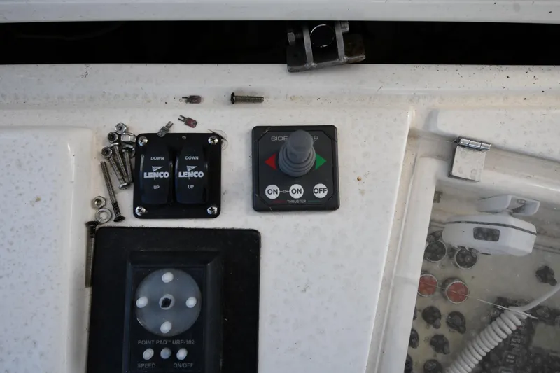 Slide: The Image of Control panel of a 2001 Ferretti Yachts 72 with switches and screws. - 37