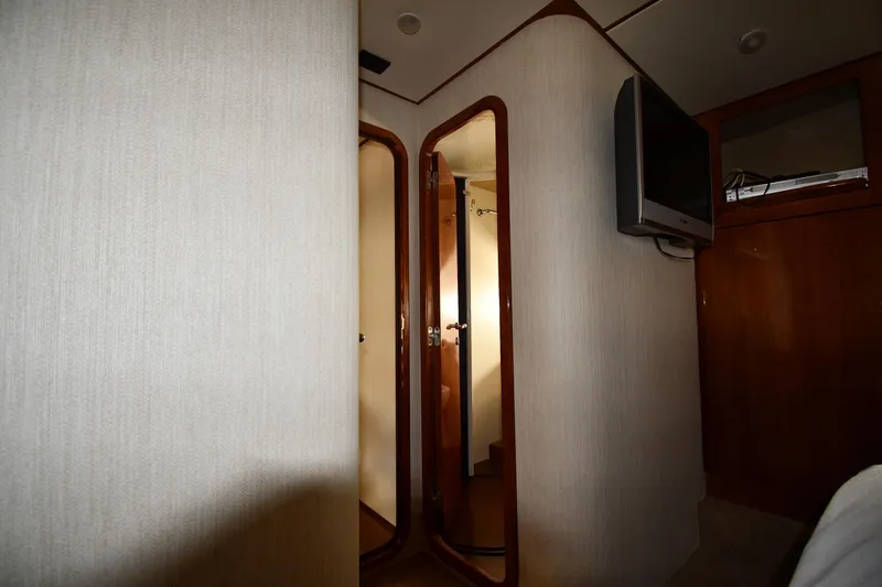Slide: The Image of Interior of 2001 Ferretti Yachts 72, featuring hallway and mounted TV. - 50