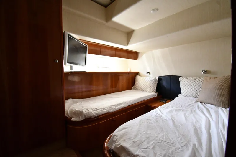 Slide: The Image of Luxurious cabin interior of 2001 Ferretti Yachts 72 with twin beds and TV. - 56