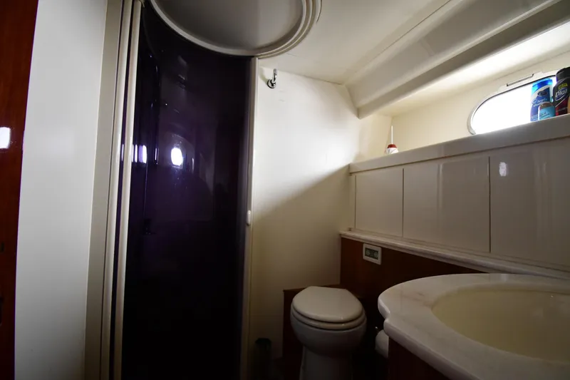 Slide: The Image of Bathroom interior of 2001 Ferretti Yachts 72, featuring toilet and sink. - 67