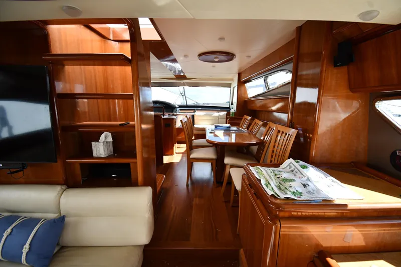 Slide: The Image of Luxurious interior of 2001 Ferretti Yachts 72 with elegant wood finishes and comfortable seating. - 82