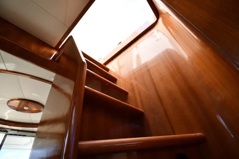 Slide: The Image of Wooden staircase inside 2001 Ferretti Yachts 72, leading to upper deck. - 83