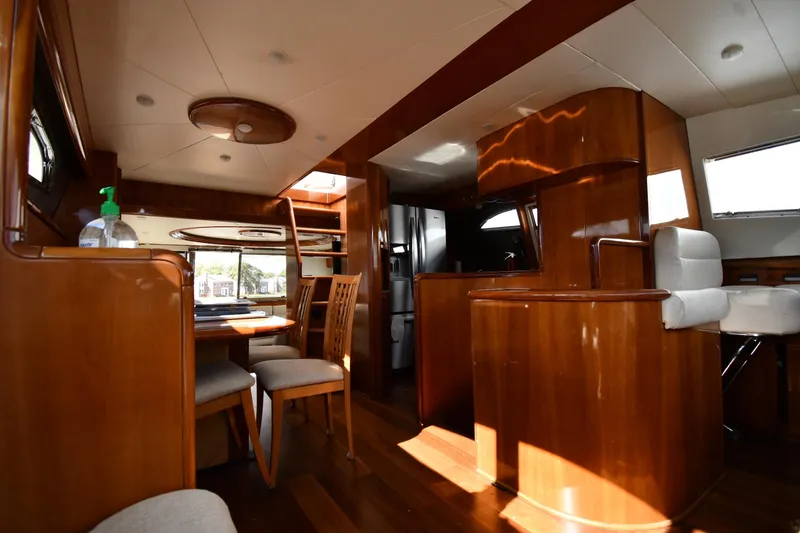 Slide: The Image of Luxurious interior of 2001 Ferretti Yachts 72 with elegant wood finishes and modern furnishings. - 86
