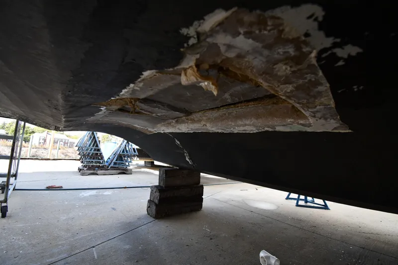 Slide: The Image of Damaged hull of 2001 Ferretti Yachts 72 on blocks, under repair. - 9