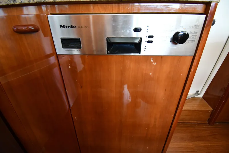 Slide: The Image of Miele dishwasher in 2001 Ferretti Yachts 72, wooden cabinetry, stainless steel panel. - 94