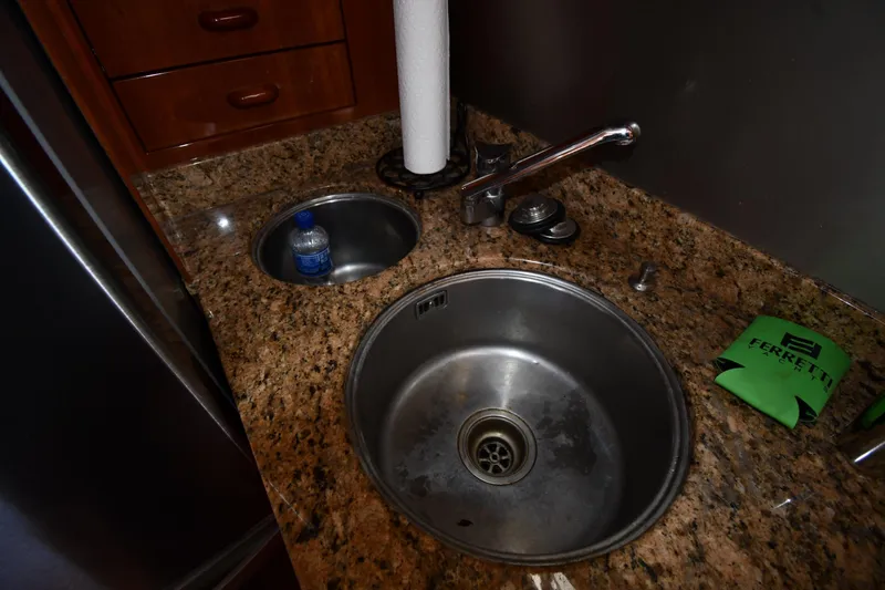 Slide: The Image of Kitchen sink area on a 2001 Ferretti Yachts 72 with granite countertop. - 96