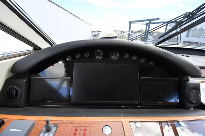 Slide: The Image of Helm of 2001 Ferretti Yachts 72 with navigation screens and controls. - 100