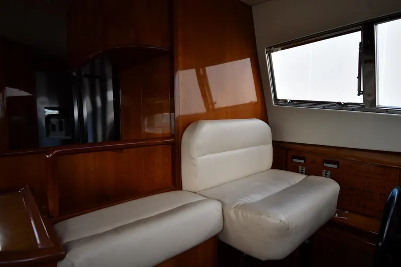 Slide: The Image of Luxurious interior of 2001 Ferretti Yachts 72 with plush seating and wooden accents. - 106