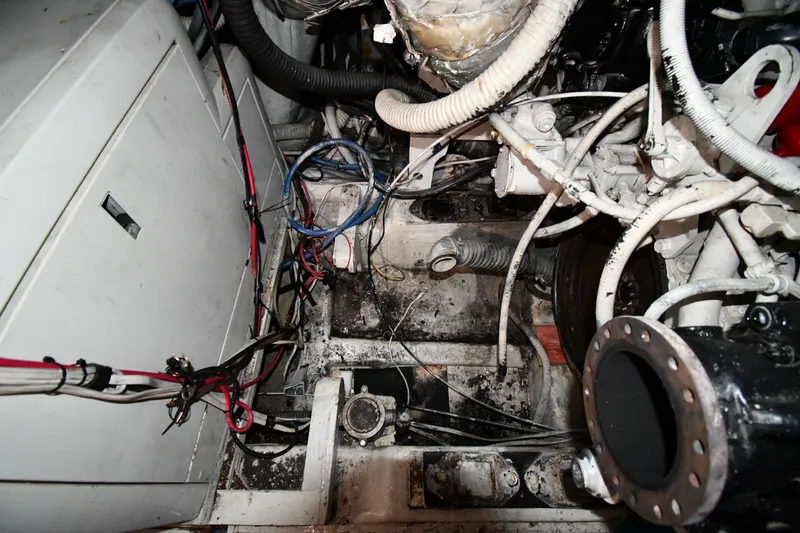 Slide: The Image of Engine room of a 2001 Ferretti Yachts 72, showing mechanical components and wiring. - 125
