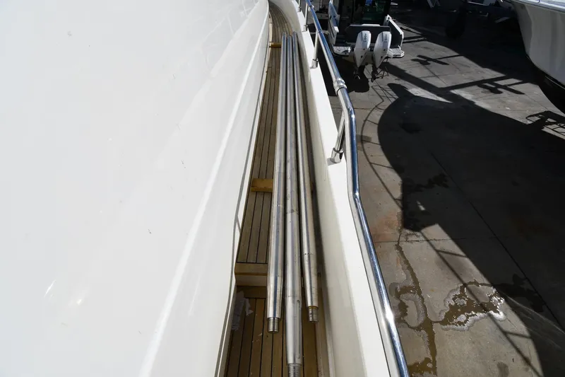Slide: The Image of Side deck view of 2001 Ferretti Yachts 72, featuring sleek railings and wooden flooring. - 13