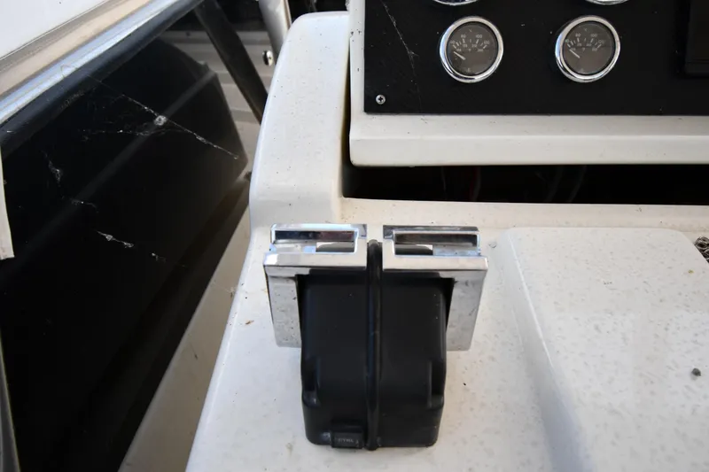 Slide: The Image of Control panel of a 2001 Ferretti Yachts 72, featuring throttle levers and gauges. - 38