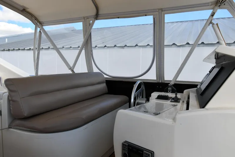 Slide: The Image of Interior view of 2001 Ferretti Yachts 72 helm with seating and controls. - 39