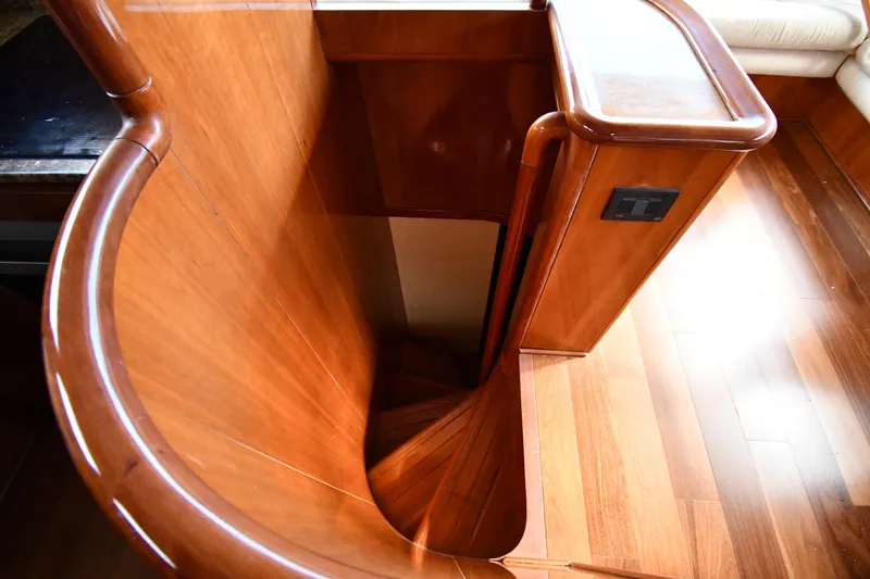 Slide: The Image of Wooden staircase inside a 2001 Ferretti Yachts 72, showcasing elegant craftsmanship. - 43