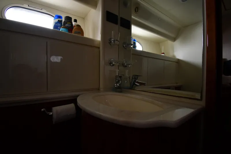 Slide: The Image of Bathroom interior of 2001 Ferretti Yachts 72, featuring sink and toiletries. - 68