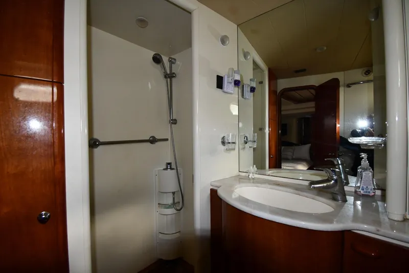Slide: The Image of Luxurious bathroom in 2001 Ferretti Yachts 72, featuring shower and dual sinks. - 77