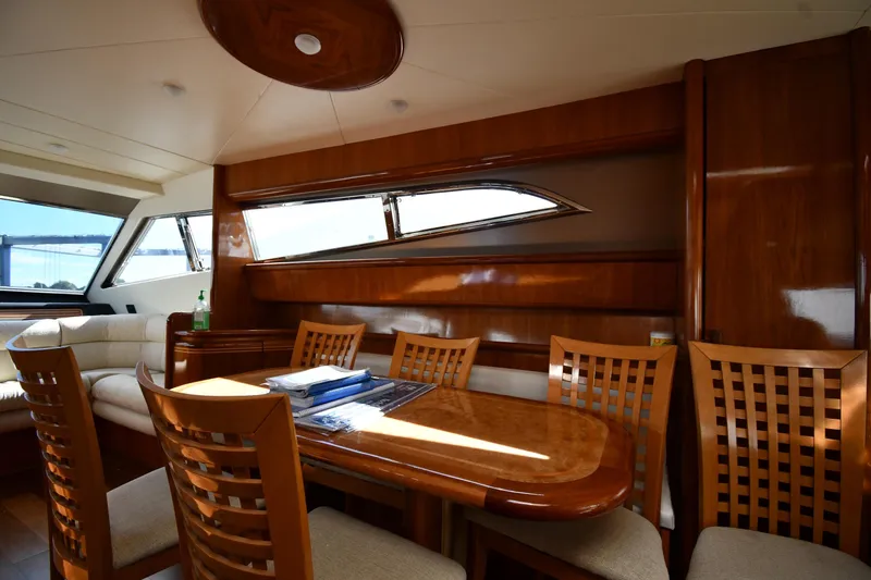 Slide: The Image of Luxurious interior of 2001 Ferretti Yachts 72 with elegant wood finishes and seating area. - 84