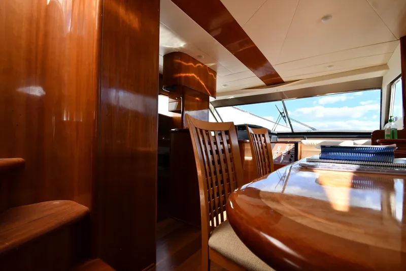 Slide: The Image of Luxurious interior of 2001 Ferretti Yachts 72 with polished wood and panoramic windows. - 85