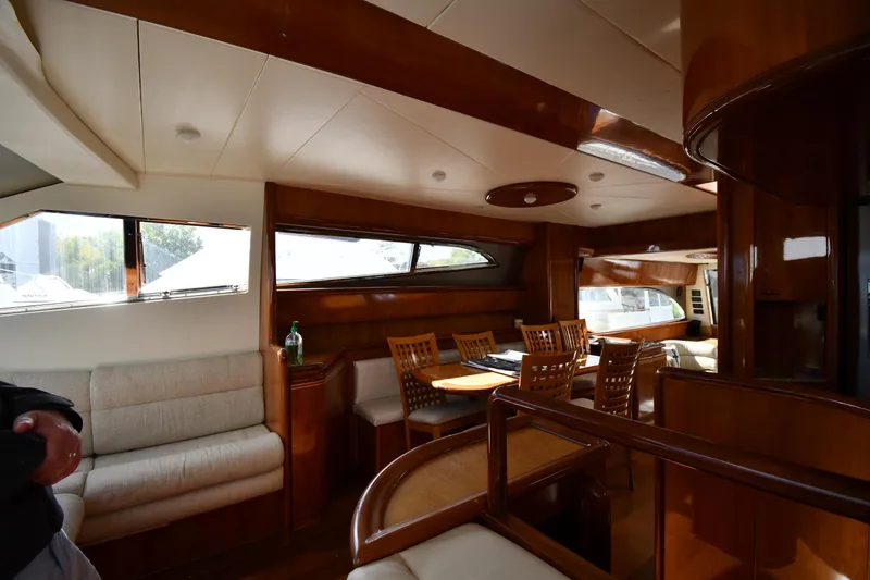 Slide: The Image of Luxurious interior of 2001 Ferretti Yachts 72, featuring elegant wood finishes and spacious seating. - 87
