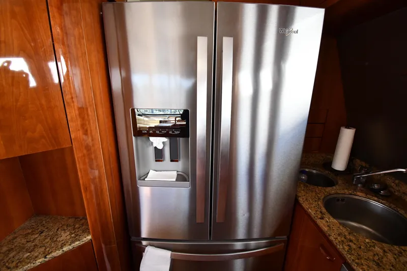 Slide: The Image of Stainless steel refrigerator in 2001 Ferretti Yachts 72 kitchen with granite countertops. - 95