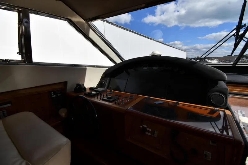 Slide: The Image of Helm of 2001 Ferretti Yachts 72 with wooden dashboard and panoramic windows. - 98