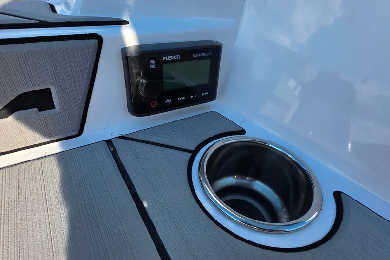 Slide: The Image of 2020 Moomba Makai boat interior with Fusion MS-NRX300 stereo and cup holder. - 11