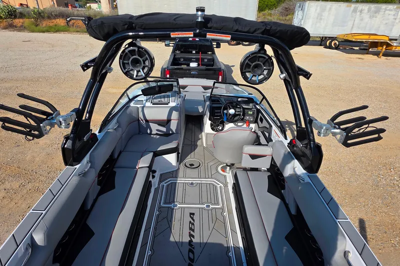Slide: The Image of 2020 Moomba Makai boat interior with sleek seating, advanced controls, and mounted speakers. - 12