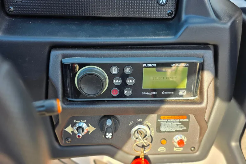 Slide: The Image of 2020 Moomba Makai dashboard with Fusion MS-RA70NSX stereo and control panel. - 24