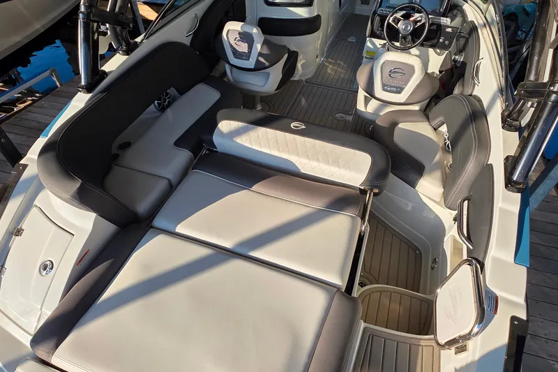 Slide: The Image of 2022 Crownline 255 SS SURF boat interior with luxurious seating and modern dashboard. - 11