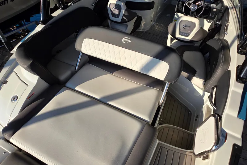 Slide: The Image of 2022 Crownline 255 SS SURF boat interior with luxurious seating and modern dashboard. - 12