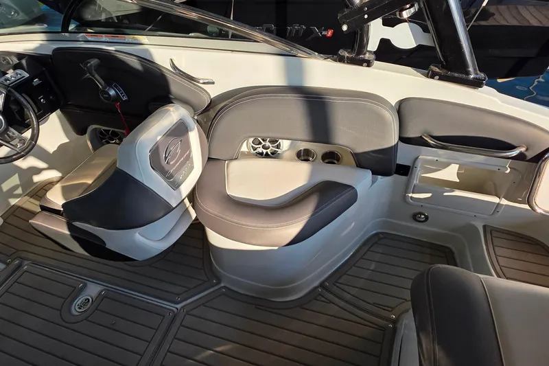 Slide: The Image of 2022 Crownline 255 SS SURF boat interior with seating and control panel. - 14