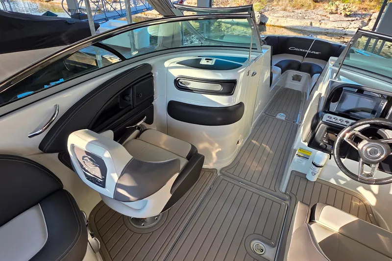 Slide: The Image of 2022 Crownline 255 SS SURF boat interior with modern seating and dashboard. - 16