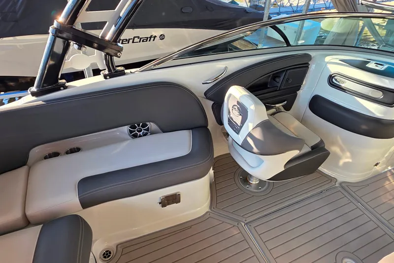 Slide: The Image of Interior of a 2022 Crownline 255 SS SURF boat with sleek seating and modern design. - 17