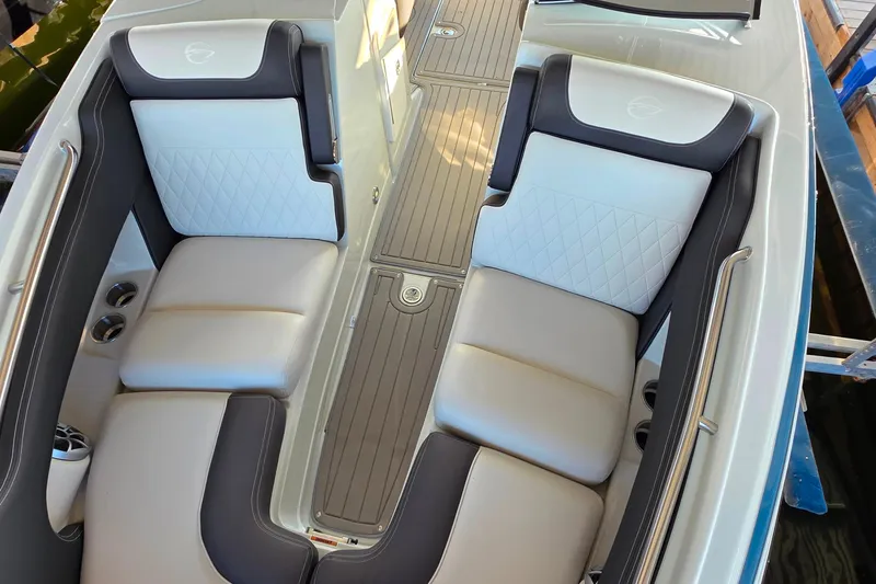 Slide: The Image of 2022 Crownline 255 SS SURF boat interior with luxurious seating and sleek design. - 21