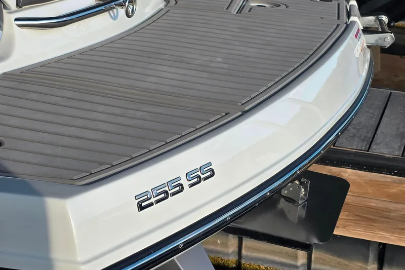 Slide: The Image of 2022 Crownline 255 SS SURF boat stern with sleek design and branding. - 3