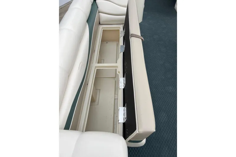 Slide: The Image of Open storage compartment in 2006 Bennington 2575 FS boat seat. - 19
