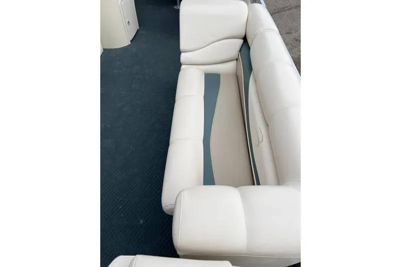 Slide: The Image of 2006 Bennington 2575 FS boat interior with white and blue seating. - 20