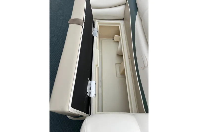 Slide: The Image of Open storage compartment in 2006 Bennington 2575 FS boat seat. - 21