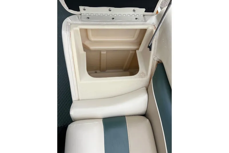 Slide: The Image of Open storage compartment in 2006 Bennington 2575 FS boat seat. - 22