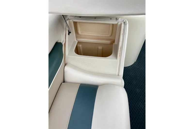 Slide: The Image of Open storage compartment in 2006 Bennington 2575 FS boat seat. - 23