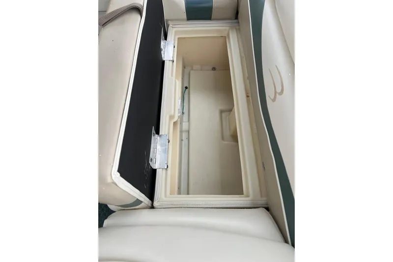 Slide: The Image of Open storage compartment on a 2006 Bennington 2575 FS boat seat. - 37