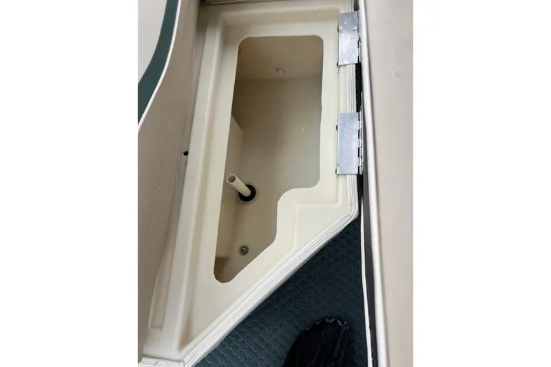 Slide: The Image of Open storage compartment on 2006 Bennington 2575 FS boat. - 38