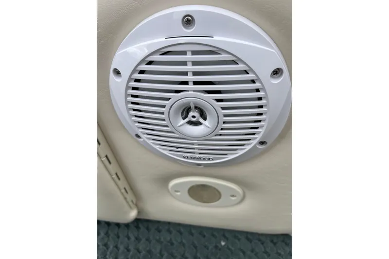 Slide: The Image of White Kenwood speaker on a 2006 Bennington 2575 FS boat interior. - 43