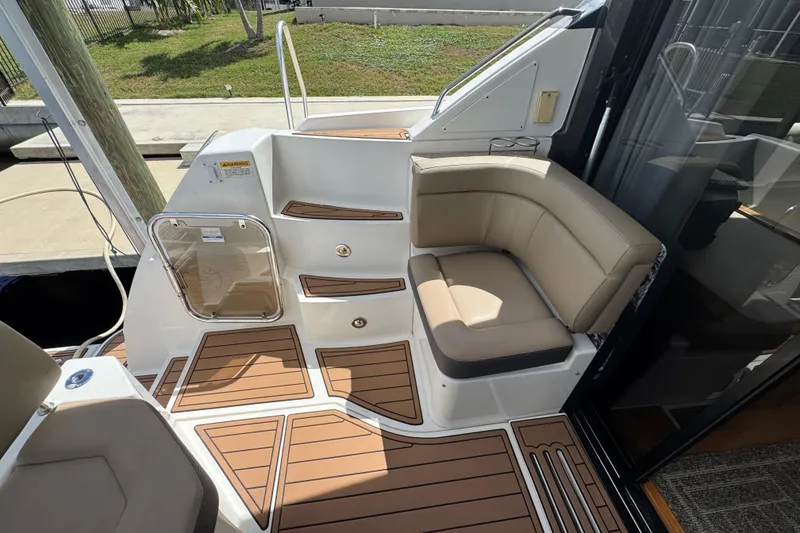 Slide: The Image of Luxurious seating area on 2016 Sea Ray 400 Sundancer yacht with teak flooring. - 10
