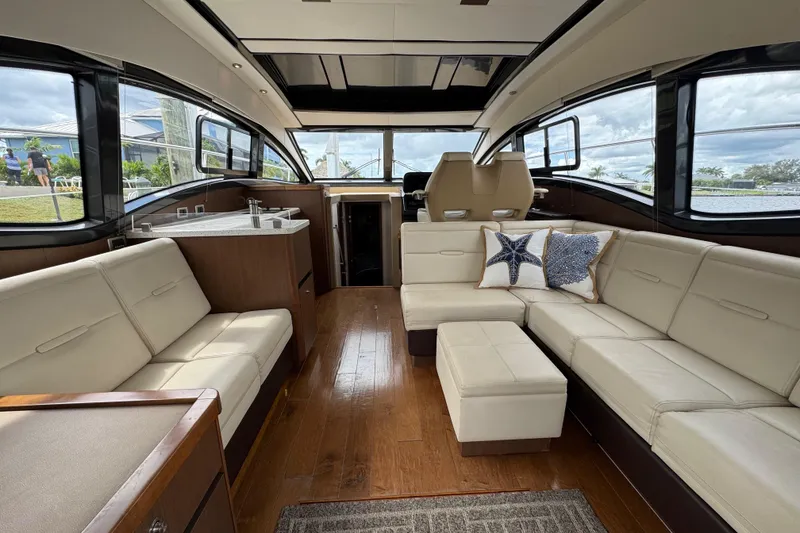 Slide: The Image of Luxurious interior of 2016 Sea Ray 400 Sundancer yacht with plush seating and modern design. - 11
