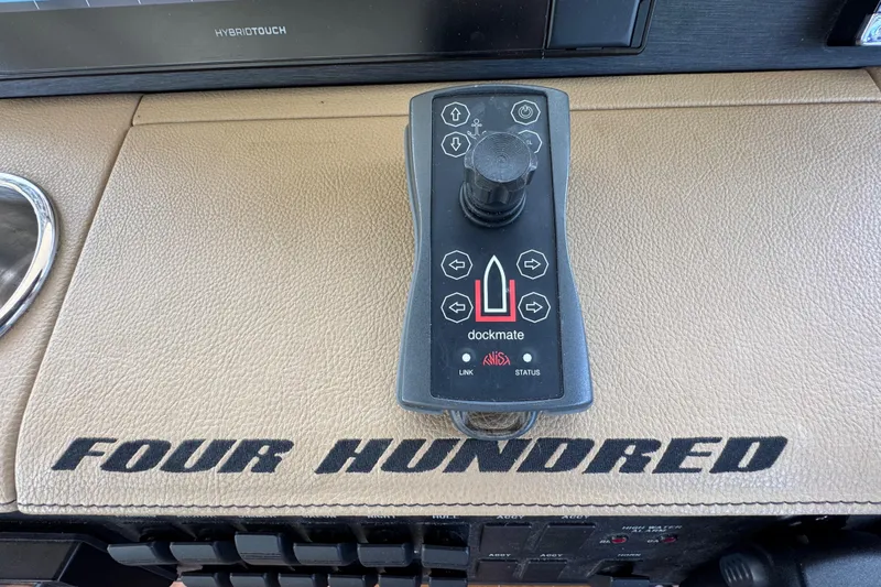 Slide: The Image of Control panel of 2016 Sea Ray 400 Sundancer with Dockmate joystick system. - 26