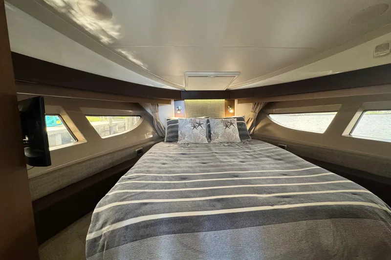 Slide: The Image of Luxurious cabin interior of 2016 Sea Ray 400 Sundancer yacht with cozy bedding. - 29