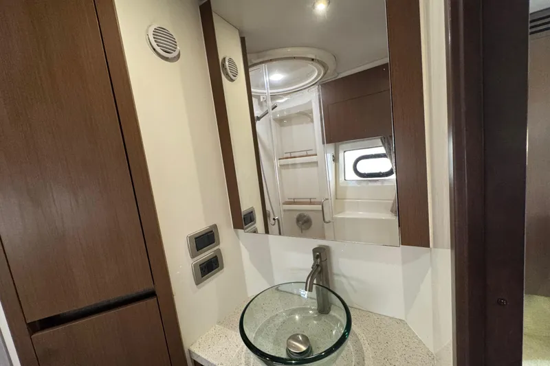 Slide: The Image of Luxurious bathroom interior of 2016 Sea Ray 400 Sundancer yacht with modern fixtures. - 34