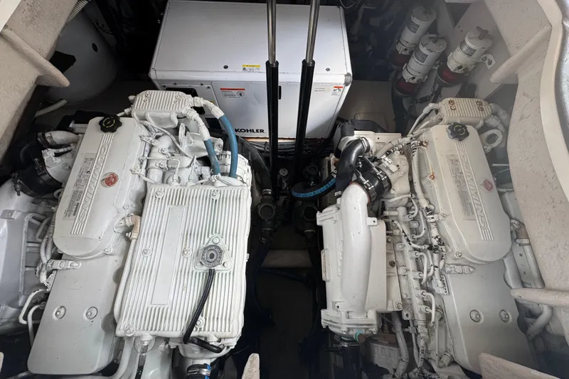 Slide: The Image of Engine room of 2016 Sea Ray 400 Sundancer with twin diesel engines and Kohler generator. - 45